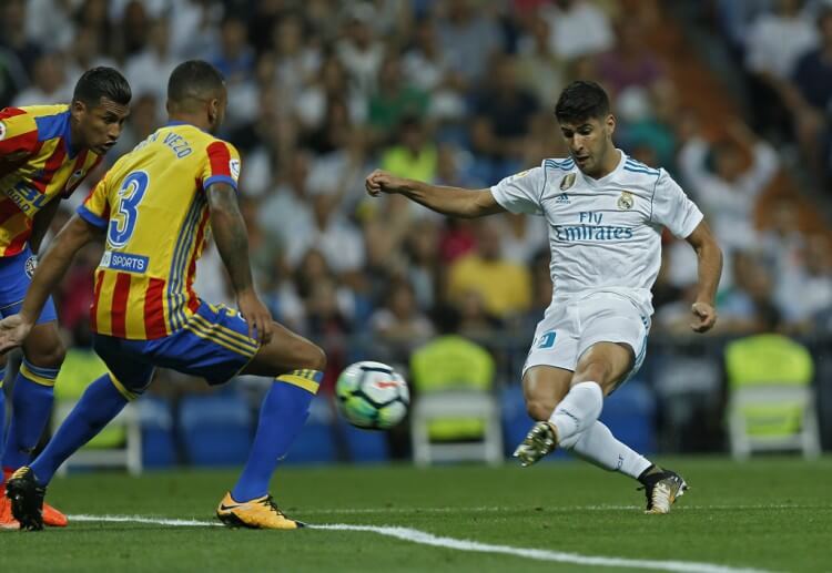 Valencia mengingkari bursa taruhan saat mereka memaksa Real Madrid untuk mengakhiri pertandingan dengan skor 2-2