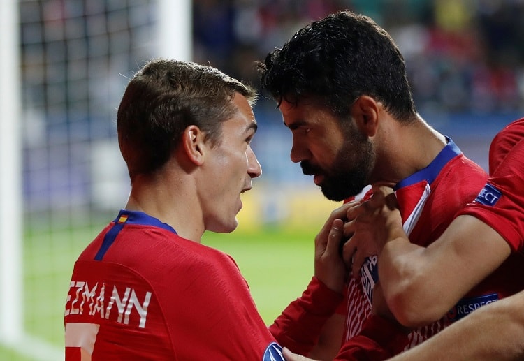 Diego Costa celebrates with Antoine Griezmann after scoring for Atletico Madrid against Real Madrid during the UEFA Super Cup