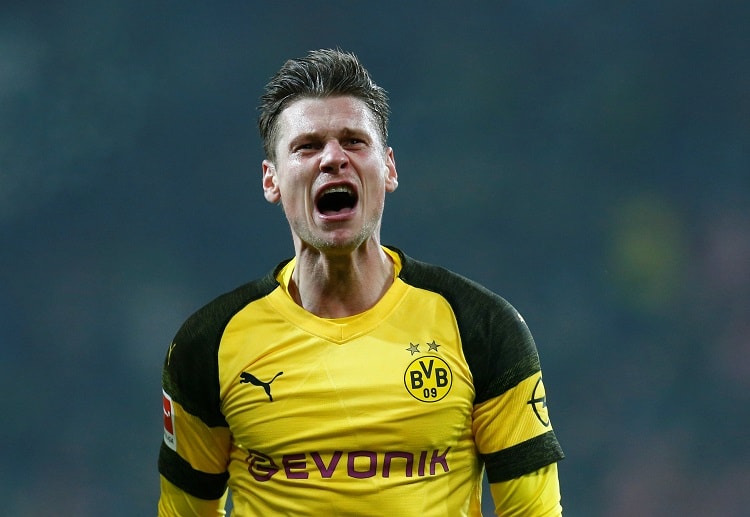 Lukasz Piszczek puts Borussia Dortmund ahead of Mainz during their Bundesliga clash