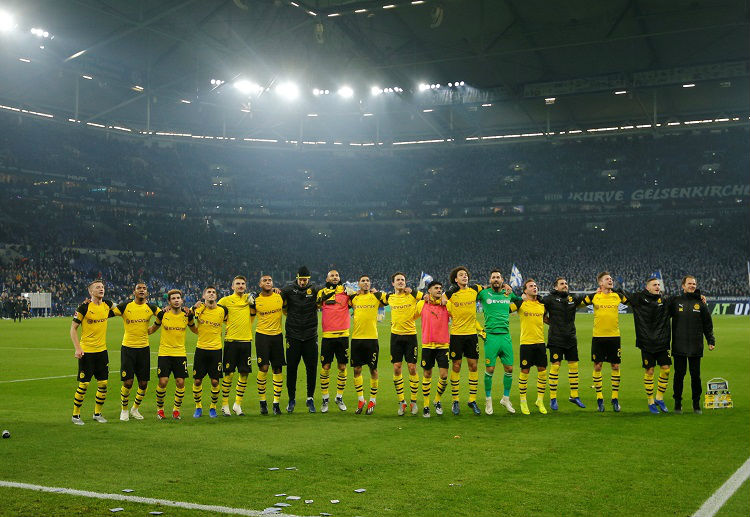 Borussia Dortmund's players line up to thanks fans after their Bundesliga win over Schalke