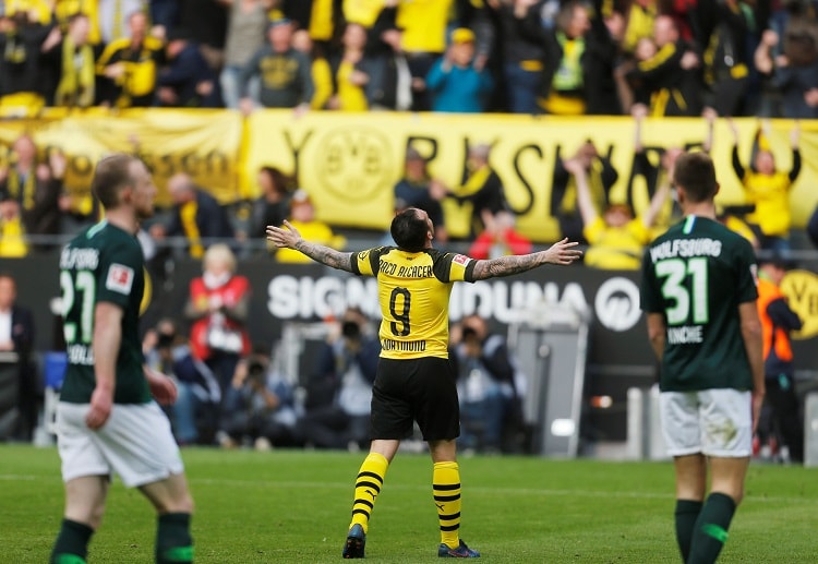 Paco Alcacer has sent Borussia Dortmund back to the top of Bundesliga after hitting last-minute goals against Wolfsburg