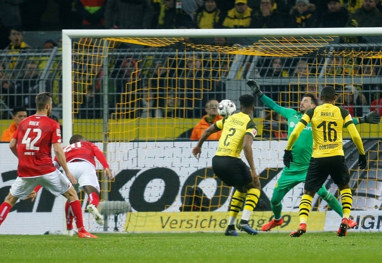 Mainz players test Roman Burki in the second half of their Bundesliga match