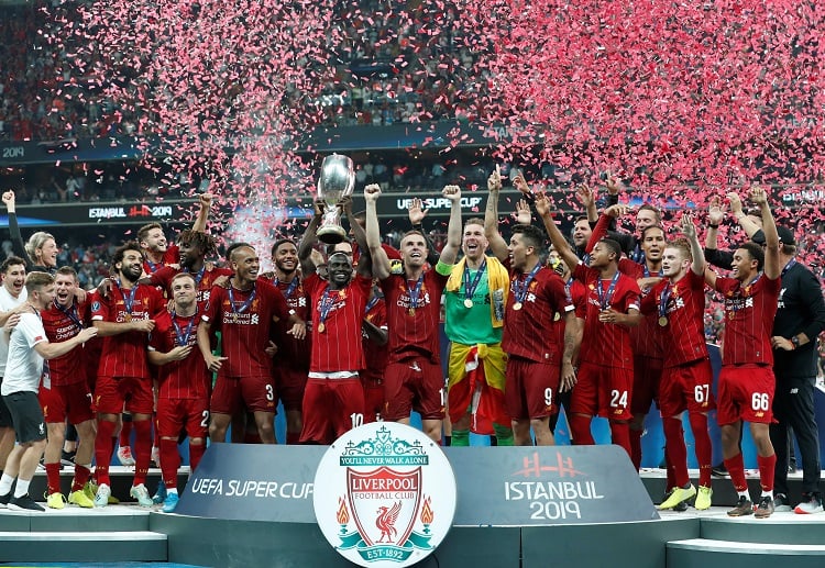 Liverpool players celebrate after beating Chelsea, 5-4 on pens, to lift the 2019 UEFA Super Cup title