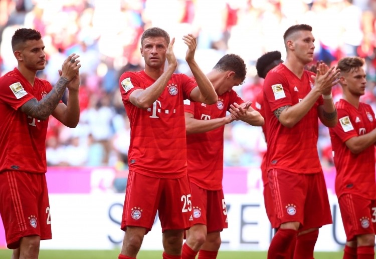 Bayern Munich players applaud the fans after their Bundesliga win against Mainz 05