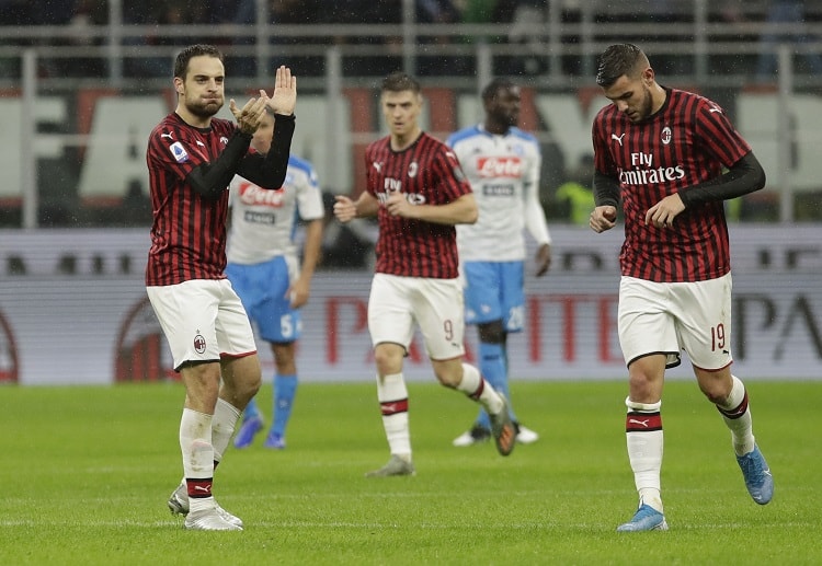 AC Milan players hail Giacomo Bonoventura after scoring a goal against Napoli in Serie A