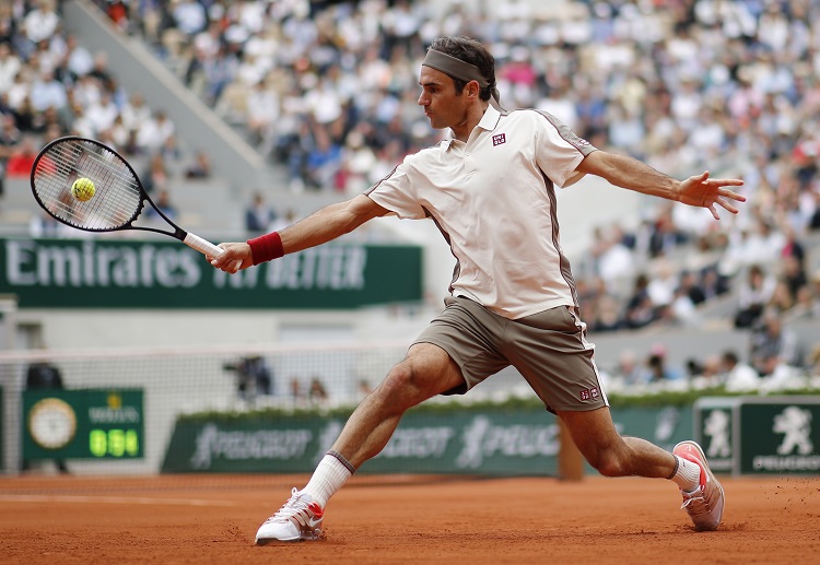 ATP star Roger Federer giving shots during a tennis tournament at the Roland Garros stadium
