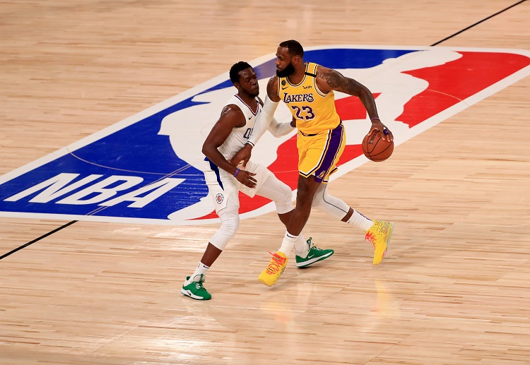 Lakers forward LeBron James dribbles the ball during the NBA match against the Clippers