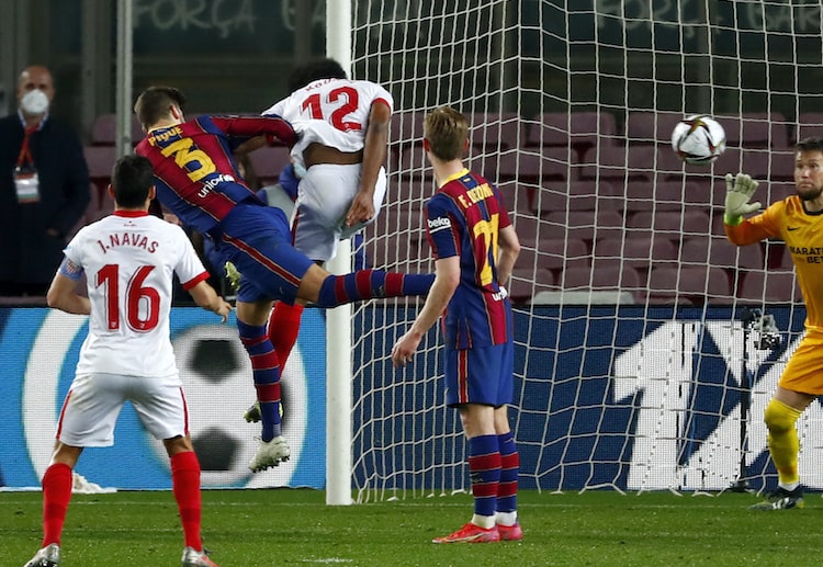 Gerard Pique's header is crucial to Barcelona's Copa del Rey victory over Sevilla