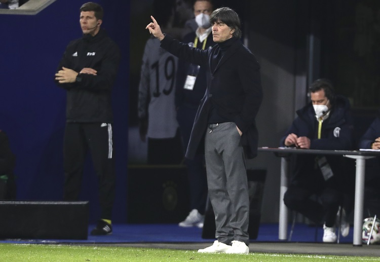Germany boss Joachim Low stands on the touchline while coaching his team