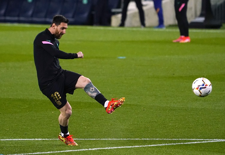 Lionel Messi warms up prior to their match against Real Sociedad