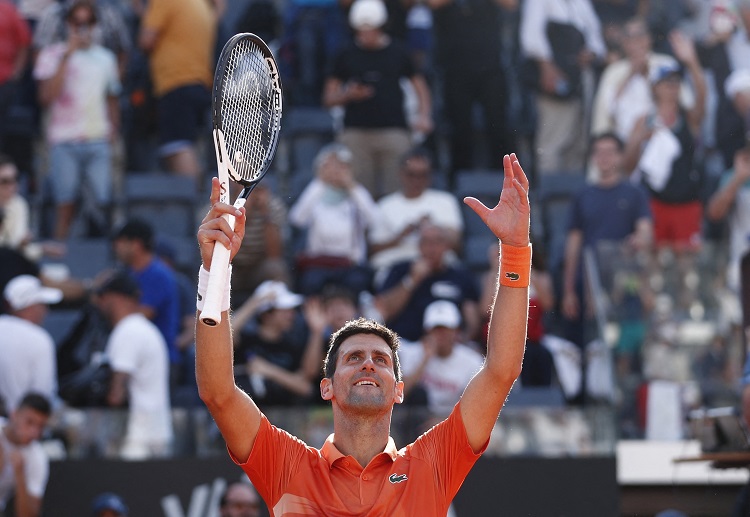 Novak Djokovic celebrates after winning his match against Aslan Karatsev in the Italian Open