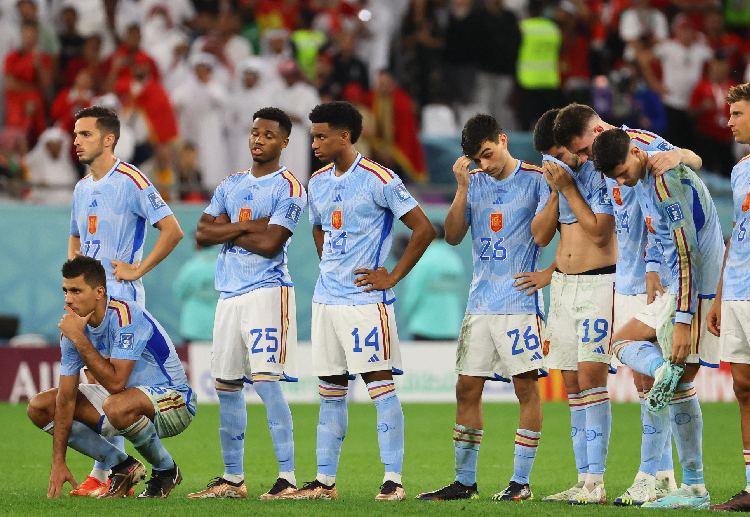 Spain players look dejected after they lose in the penalty shootout against Morocco in World Cup 2022