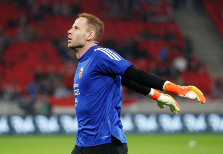 Hungary's Peter Gulacsi aims to keep Serbia from scoring as they clash in the Euro 2024 qualifiers
