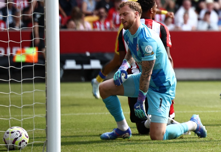 Brentford goalkeeper Mark Flekken aims to keep the Spurs from scoring in their upcoming away match in Premier League